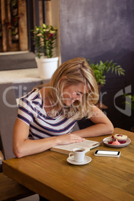 Woman reading a book sitting