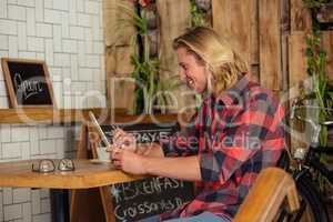 Man using a tablet sitting