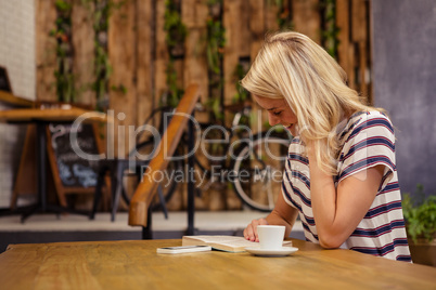 Woman reading a book sitting