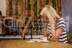 Woman reading a book sitting