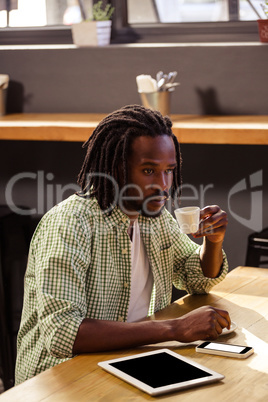 Man drinking a cup of coffee