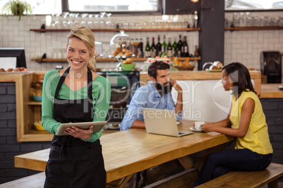 Waitress holding a tablet