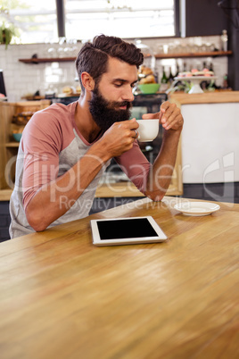 Man drinking a cup of coffee