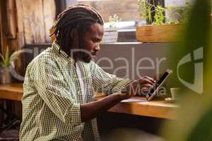 Man using a tablet sitting