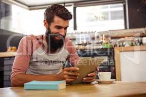 Man using a tablet sitting