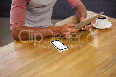 Man using a tablet sitting