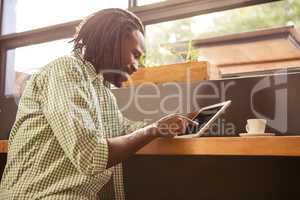 Man using a tablet sitting