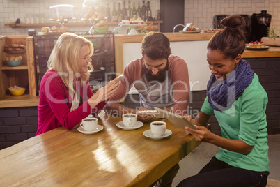 Friends using technology sitting