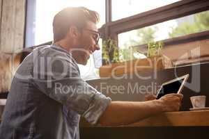 Man using a tablet sitting