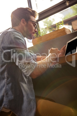 Man using a tablet sitting