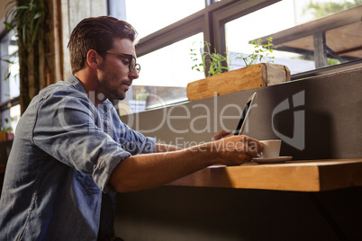 Man using a tablet sitting