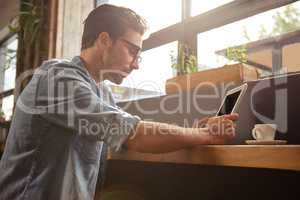 Man using a tablet sitting