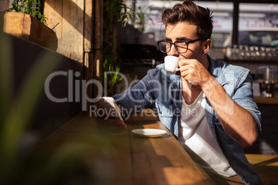 Man drinking a cup of coffee