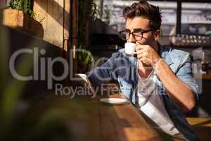 Man drinking a cup of coffee