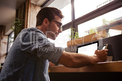 Man using technology sitting Man using technology sitting