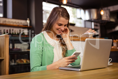Smiling woman using technology