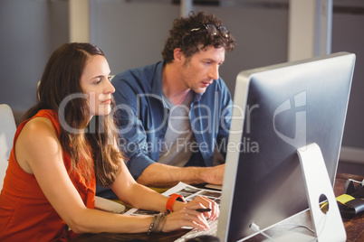 Casual colleagues using computer