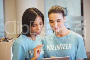 Volunteers using a tablet