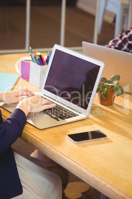 Close up view of businessman using laptop computer