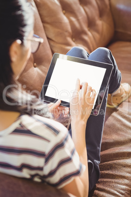 Businesswoman lying on a sofa