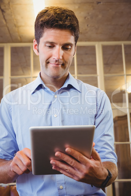 Business man posing with his tablet Business man posing with his tablet