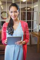 Businesswoman posing with her tablet