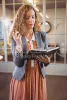 Business woman holding a book