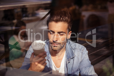 Attractive casual man drinking coffee