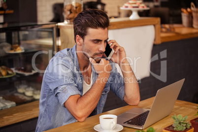 Side view of hipster man working