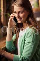 Portrait of casual woman on the phone
