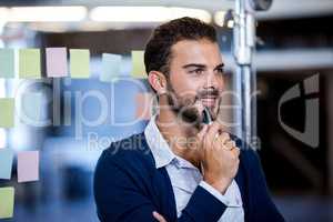 Businessman smiling and reflecting