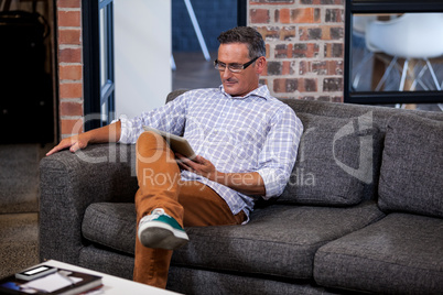 Businessman looking his tablet computer