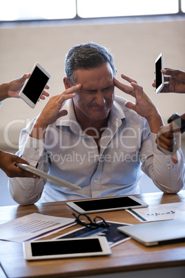 Overwhelmed businessman by his work