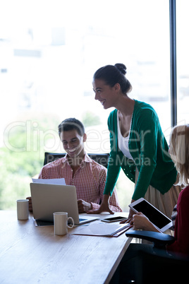 Coworkers smiling during a meeting