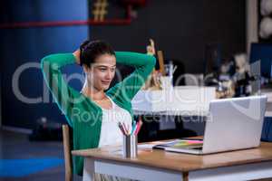 Relaxed businesswoman front of her laptop
