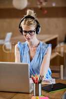 Portrait of businesswoman working on her laptop