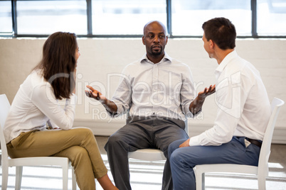 Coworkers talking during a meeting
