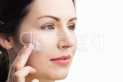 Woman applying a cream