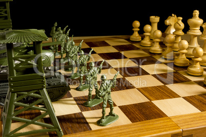 Chess pieces and toy soldiers