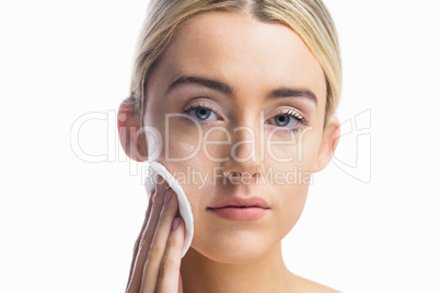 Beautiful woman putting makeup