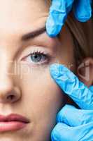 Woman has an examination of her skin before botox injection