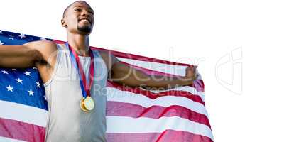 Portrait of happy sportsman posing with an american flag