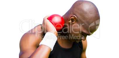 Portrait of sportsman practising shot put