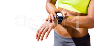 Close up on a sportswoman wearing a connected watch