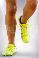 Composite image of close up of sportsman legs running on a white