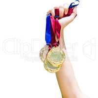Hand holding three medals