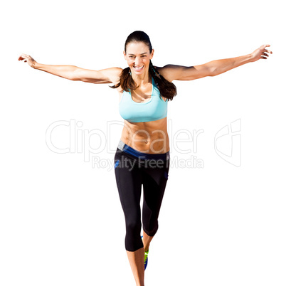 Happy sportswoman is raising arms