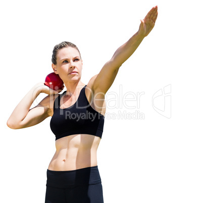 Sportswoman practicing the shot put