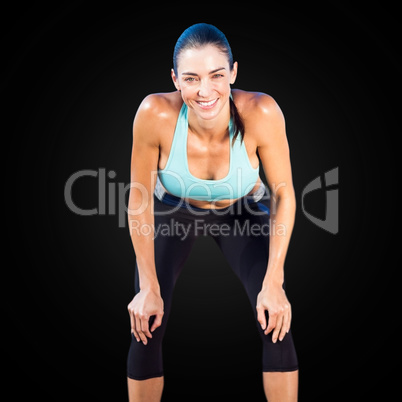 Sportswoman posing his hands on knee
