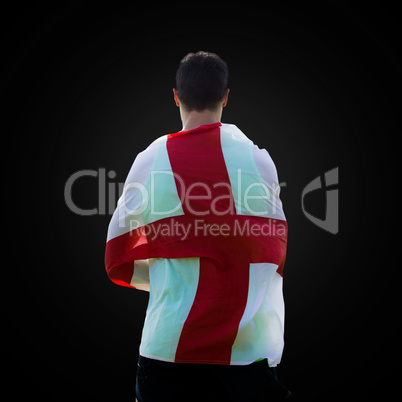 Rear view of sportsman holding an England flag